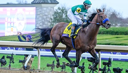 Flightline, under a smiling Flavien Prat, pulls away for an easy victory in the 2022 Breeders' Cup Classic at Keeneland