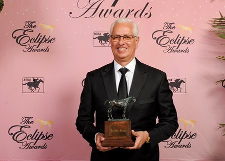 Todd Pletcher holds his champion trainer trophy at the 2022 Eclipse Awards