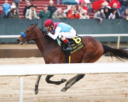 Arabian Knight splashes home to win the Southwest Stakes at Oaklawn Park