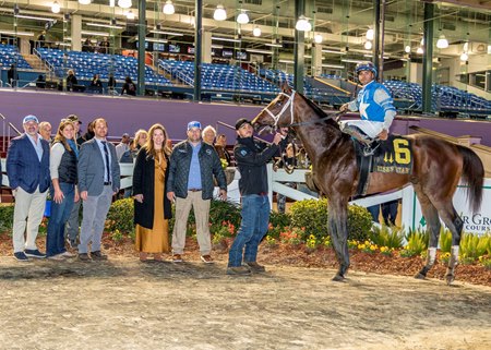 Connections of Angel of Empire gather in the Fair Grounds winner's circle after the Risen Star Stakes