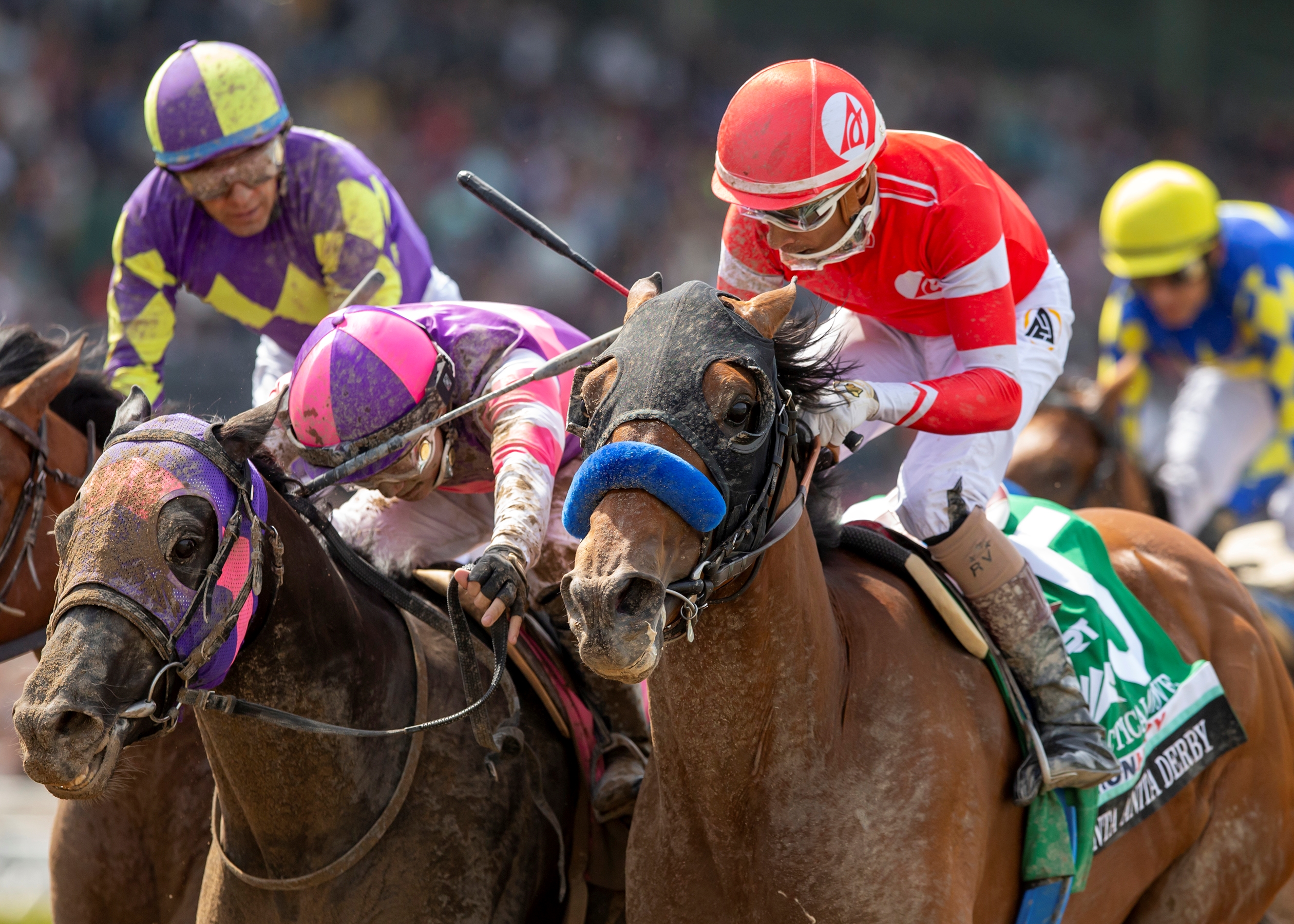 Practical Move (red cap) runs down the competition in the Santa Anita Derby at Santa Anita Park