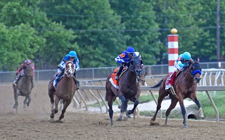 National Treasure leads Blazing Sevens en route to victory in the Preakness Stakes at Pimlico Race Course