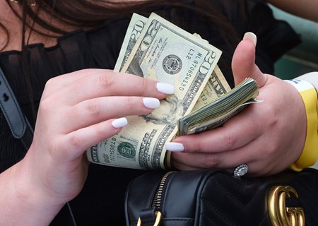 Counting cash on Kentucky Derby Day at Churchill Downs