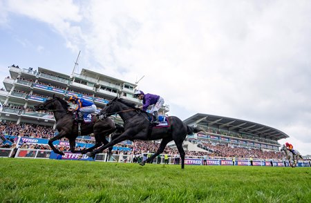 Auguste Rodin (far side) prevails over King of Steel to win the Betfred Derby at Epsom Racecourse