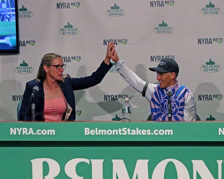 Arcangelo's trainer and rider share a jubilant moment after the ridgling's victory in the Belmont Stakes 