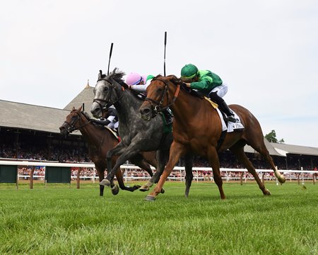 Whitebeam (pink cap) wins the 2023 Diana Stakes at Saratoga Race Course