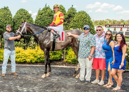 Jayde Gelner (third from the left)  in the winner's circle at Louisiana Downs