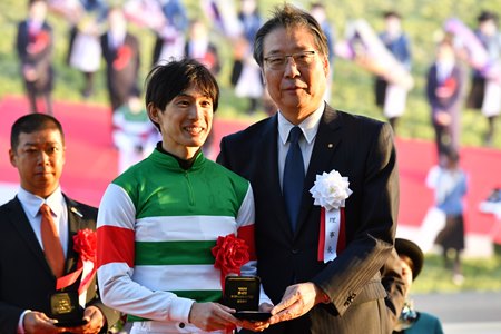 (L-R): Jockey Kota Fujioka with trainer Tomokazu Takano after a victory from Namur in the Mile Championship at Kyoto Race Course