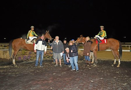 Bush Racing Stable's Crazy Legs Hirsch and My Redemption in the winner's circle after dead-heating for first in an allowance optional claiming race at Penn National Race Course