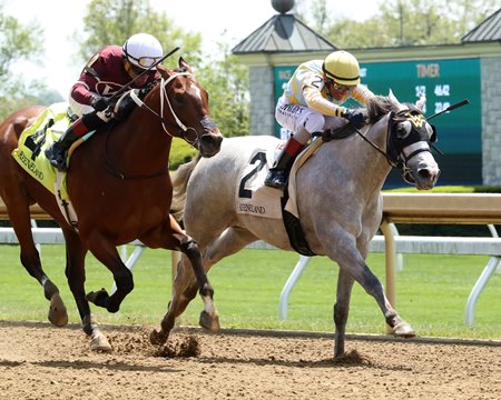 Dreamaway (right) fends off Clever Again to capture her debut at Keeneland 