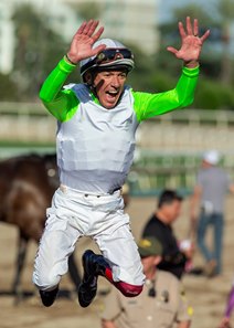 Frankie Dettori does his flying dismount after winning the Royal Heroine Stakes on Uncorked at Santa Anita Park