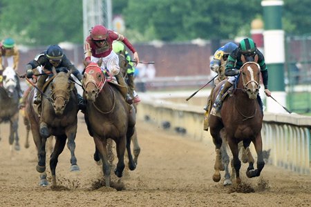 Mystik Dan (far right) wins the Kentucky Derby at Churchill Downs