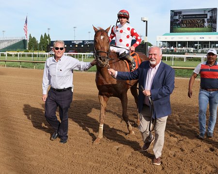 Dr. Barrett Bernard (L) and Terry Stephens (R) with O Besos after winning the St. Matthew Overnight Stakes at Churchill Downs