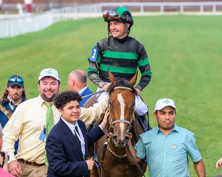 Mystik Dan enters the Kentucky Derby infield winner's circle at Churchill Downs