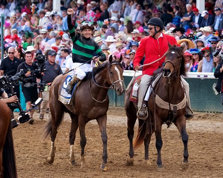 Brian Hernandez Jr. celebrates aboard Mystik Dan after his victory in the Kentucky Derby at Churchill Downs