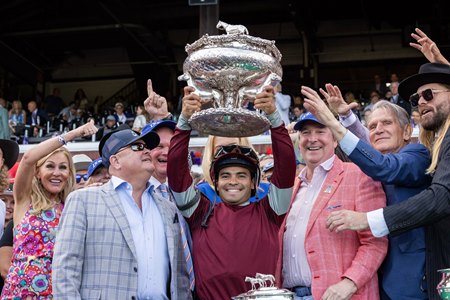 Jockey Luis Saez lifts the Belmont trophy