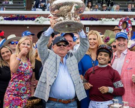 Danny Gargan hoists the 2024 Belmont Stakes trophy after Dornoch's victory at Saratoga Race Course