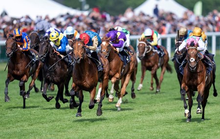 Kikkuli finishes second, beaten a nose by Haatem (red cap), in the Jersey Stakes at Ascot Racecourse