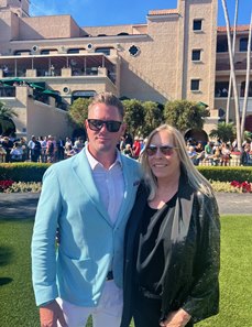 Janie Buss with Joseph Barton, a partner in Purple Rein Racing