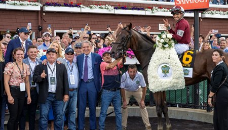 Randy Hill (blue suit) in the winner's circle with the connections of Dornoch after the Belmont Stakes  