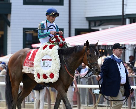 Book'em Danno enters the winners' circle following his victory in the Woody Stephens Stakes at Saratoga Race Course