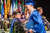 Congratulating the students on stage during the commencement ceremony at graduation was one of Dean Cox&#39;s many passions in the role