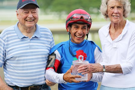 John Bowers Jr., left, with jockey Paco Lopez after He'spuregold won his fourth straight Irish War Cry Handicap in 2024