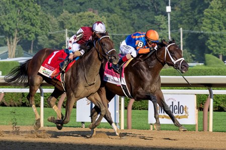 Fierceness (inside) holds off filly Thorpedo Anna in the Travers Stakes at Saratoga Race Course