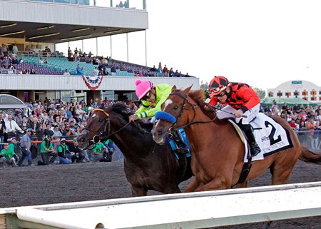 Five Star General (pink cap) wins the Longacres Mile Stakes at Emerald Downs 