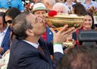 Fierceness owner Mike RepoleK kisses the Man O War winners  trophy after winning the 155th running of these Travers Stakes at the Saratoga Race Course Saturday Aug 24, 2024 in Saratoga Springs, N.Y.  Photo  by Skip Dickstein