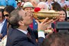 Fierceness owner Mike RepoleK kisses the Man O War winners  trophy after winning the 155th running of these Travers Stakes at the Saratoga Race Course Saturday Aug 24, 2024 in Saratoga Springs, N.Y.  Photo  by Skip Dickstein