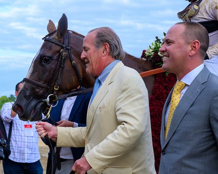 Owner/breeder Jon Clay leads Raging Sea into the winner's circle after the 2024 Personal Ensign Stakes at Saratoga Race Course