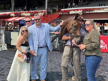 Connections of My Boy Tate accepting Down Broadway Retired Racehorse of the Year Award in 2024