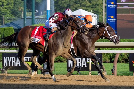 Fierceness (inside) holds off Thorpedo Anna to win the Travers Stakes at Saratoga Race Course