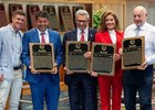 Co-owners of Justify;  Mike Smith from China Horse Club left, Sol Kumin, Kenny Troutt, Lisa Troutt and Jack Wolf receive the ceremonial plaque honoring new Hall of Fame Justify during the Hall of Fame inductions at the Fasig Tipton Pavilion Aug 2, 2024 in Saratoga Springs, N.Y.  Photo  by Skip Dickstein
