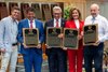 Co-owners of Justify;  Mike Smith from China Horse Club left, Sol Kumin, Kenny Troutt, Lisa Troutt and Jack Wolf receive the ceremonial plaque honoring new Hall of Fame Justify during the Hall of Fame inductions at the Fasig Tipton Pavilion Aug 2, 2024 in Saratoga Springs, N.Y.  Photo  by Skip Dickstein