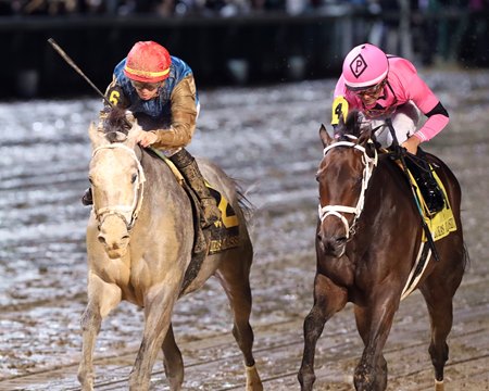 Hit Show (left) runs down Cooke Creek to win the Lukas Classic Stakes at Churchill Downs