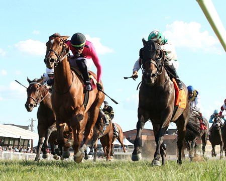 Safeen (inside) defeats She's Lookin Lucky by a head to win the One Dreamer Stakes at Kentucky Downs