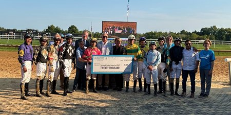 A check presentation is made to the Permanently Disabled Jockeys Fund at Delaware Park