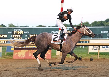 Jaime Torres celebrates a dominant victory by Seize the Grey in the Pennsylvania Derby at Parx Racing