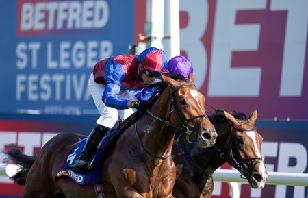 Jan Brueghel (outside) defeats Illinois to win the St Leger Stakes at Doncaster Racecourse