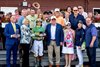 Flavien Prat receives the winners trophy from National Museum of Racing’s Stella Thayer after he rode Chancer McPatrick after winning  the 120th running of the Hopeful at the Saratoga Race Course Monday Sept 2, 2024 in Saratoga Springs, N.Y.  With Prat is trainer Chad Brown left, and owner Sean Flanagan, center front row.  Photo  by Skip Dickstein