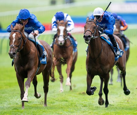 Shadow of Light (left) wins the 2024 Dewhurst Stakes at Newmarket Racecourse