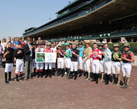 Irad Ortiz Jr. celebrates his 4,000th career victory with members of the Keeneland jockey colony