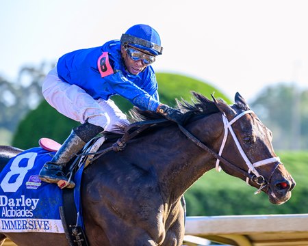 Immersive and rider Manny Franco win the Alcibiades Stakes at Keeneland