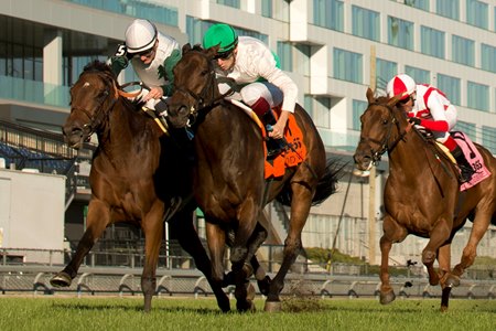 Mouffy (green cap) holds off Nadette to win the Dance Smartly Stakes at Woodbine