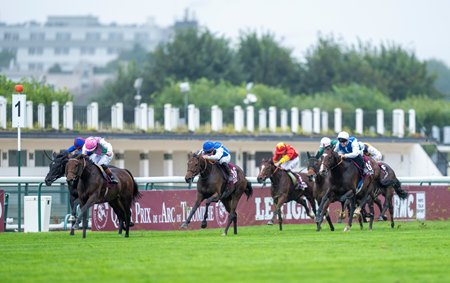 Horses race through the stretch in the 2024 Prix de l'Arc de Triomphe at ParisLongchamp