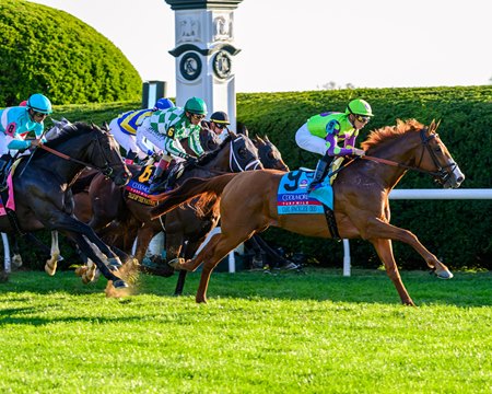 Carl Spackler leads the Coolmore Turf Mile field into the first turn at Keeneland