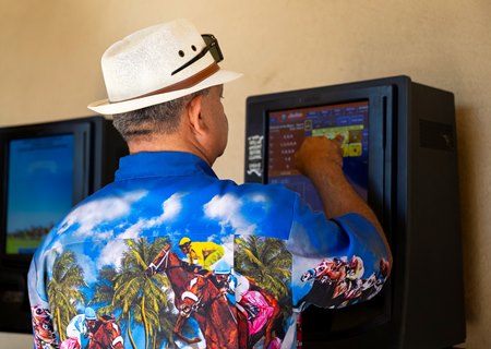 A bettor wagers at Del Mar