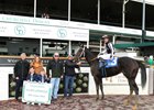 Julien Leparoux and family celebrating in the winner's circle after Race 3 at Churchill Downs